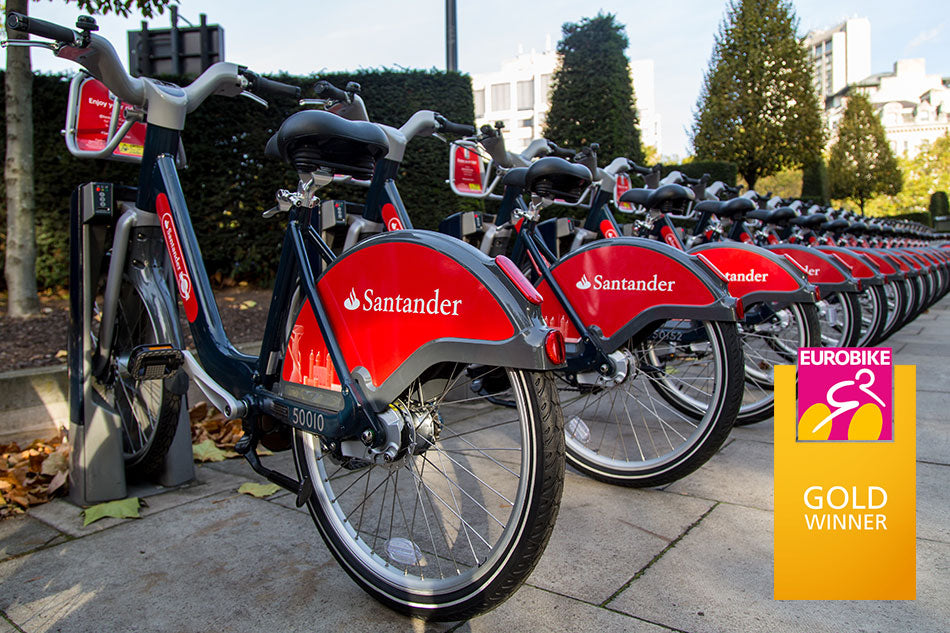 A row of Santander London Hire bikes, made by Pashley Cycles, docked in central London.