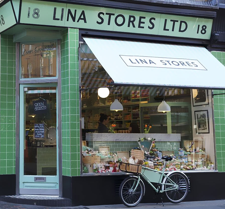 Pashley courier bicycle on display outside deli store with nameboard