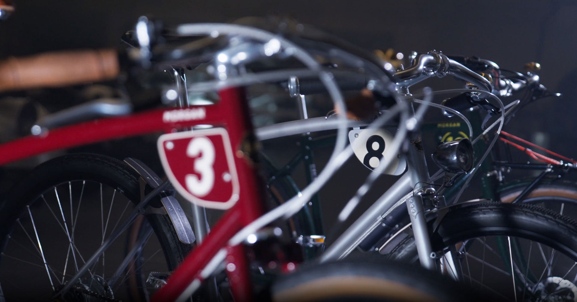 Close-up of number plates of the three Pashley-Morgan bicycles.