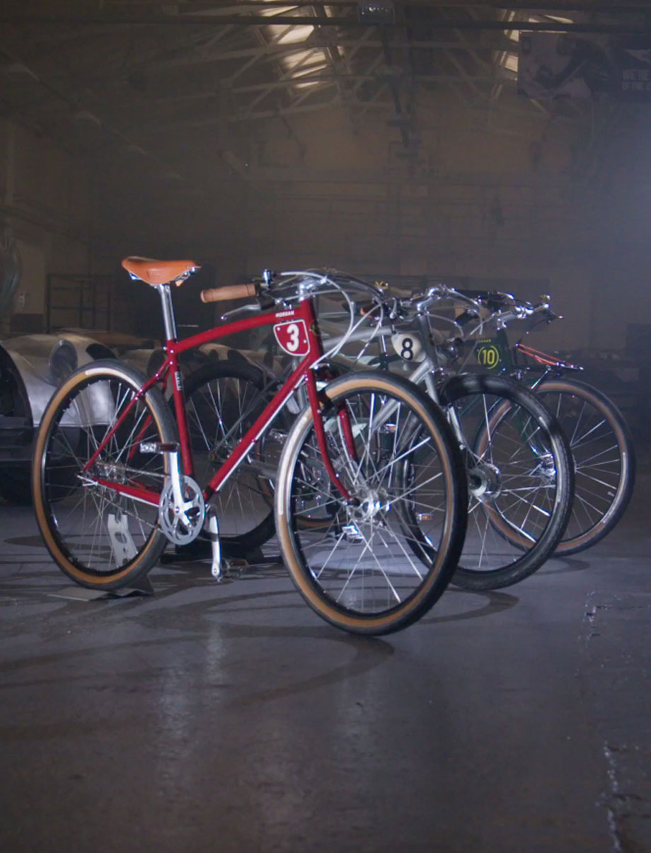 Three Pashley-morgan bikes in a row - red, silver, green.