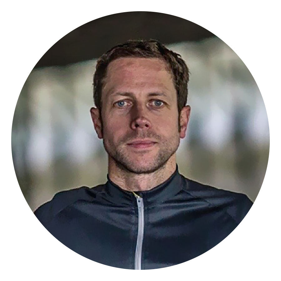 Head shot of Andy Smallwood wearing a blue cycling jersey.