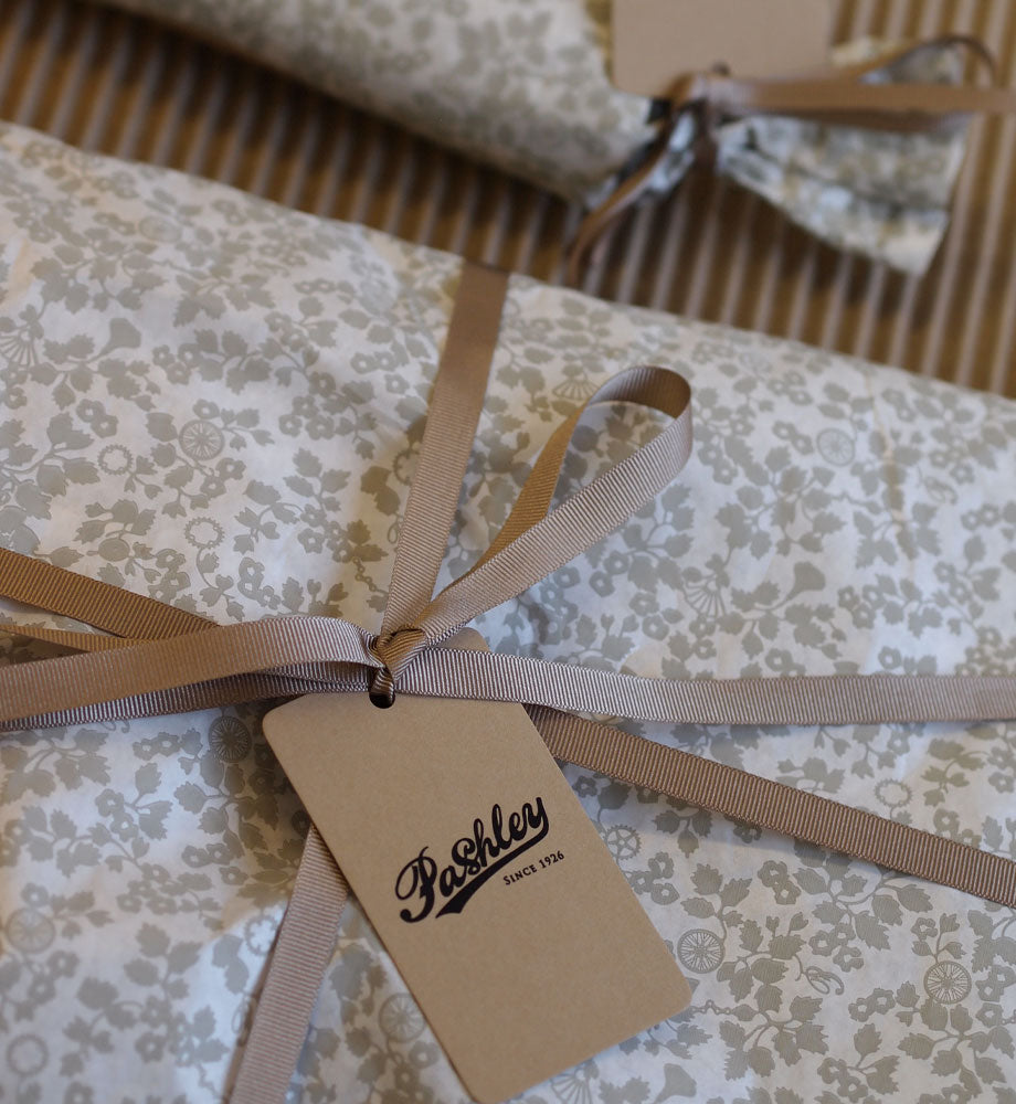 Gift wrapped in Pashley print wrapping paper with taupe ribbon and Pashley logo gift tag.