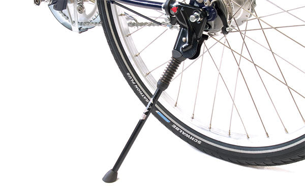 Rear bicycle wheel with kick-down propstand fitted to the axle.