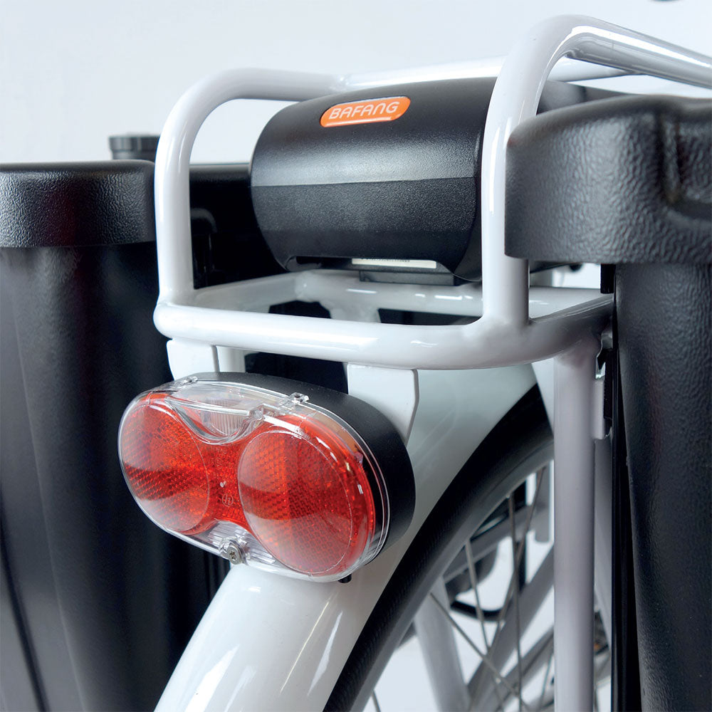 Close-up of a rear carrier mounted red LED bike light.