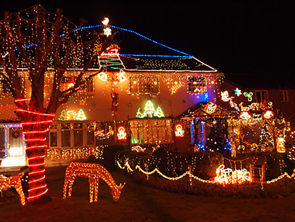 A house covered in colourful Christmas lights.
