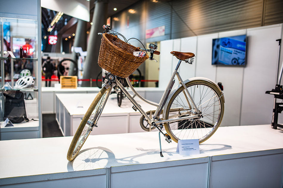 A white Pashley Britannia classic bike with wicker basket on display in Poland.