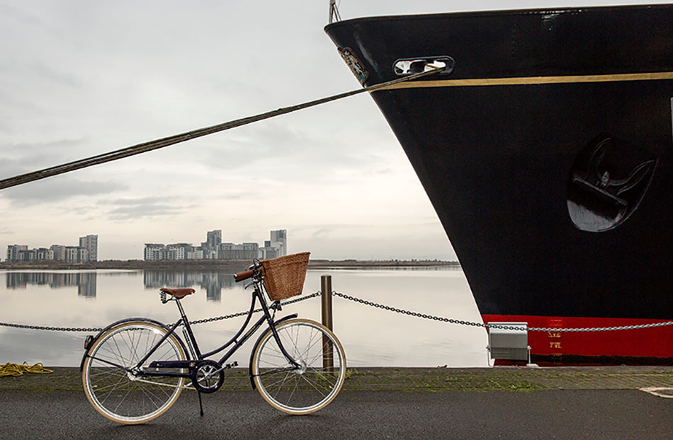 The Pashley Britannia bicycle parked on the dockside next to the Royal Yacht Britannia in Edinburgh.