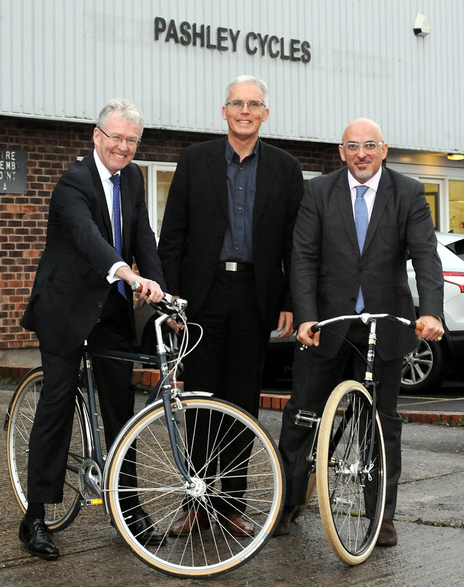 Larry Coltman, Adrian Williams, and Nadhim Zahawi standing together outside the Pashley Cycles factory.
