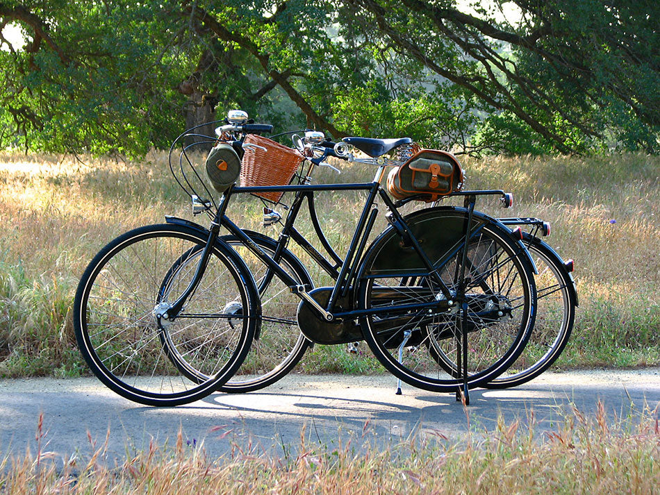 Classic black lady's and gentleman's Pashley bicycles standing together on a cycle path in California