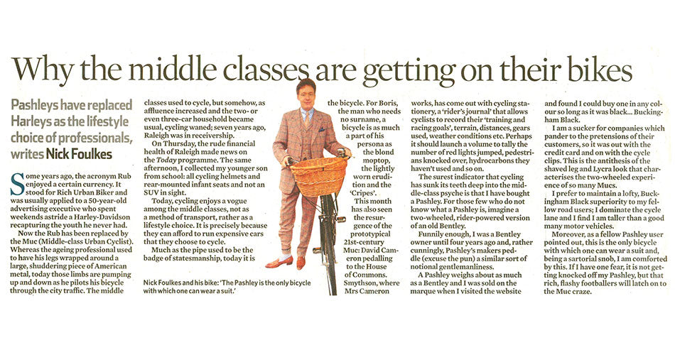 Image of The Observer article showing Nick Foulkes next to a Pashley Princess bicycle with wicker basket