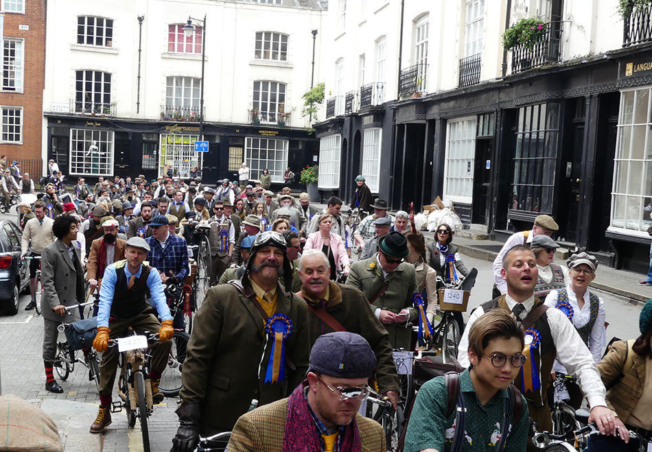 Cyclist grouped together in a street in London during the 2017 Tweed Run cycle ride.