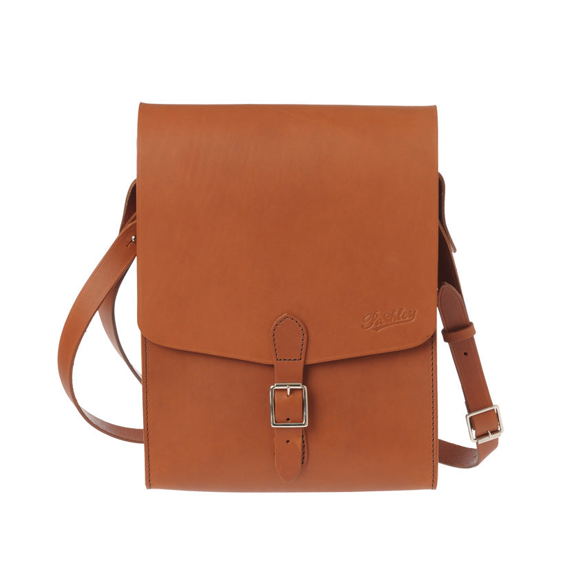 Leather dispatch bag with shoulder and anti-swing strap, and large front buckle closure.