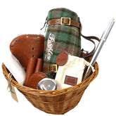 A wicker basket with Pashley gifts inside