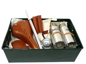 A green steel tray with gifts inside