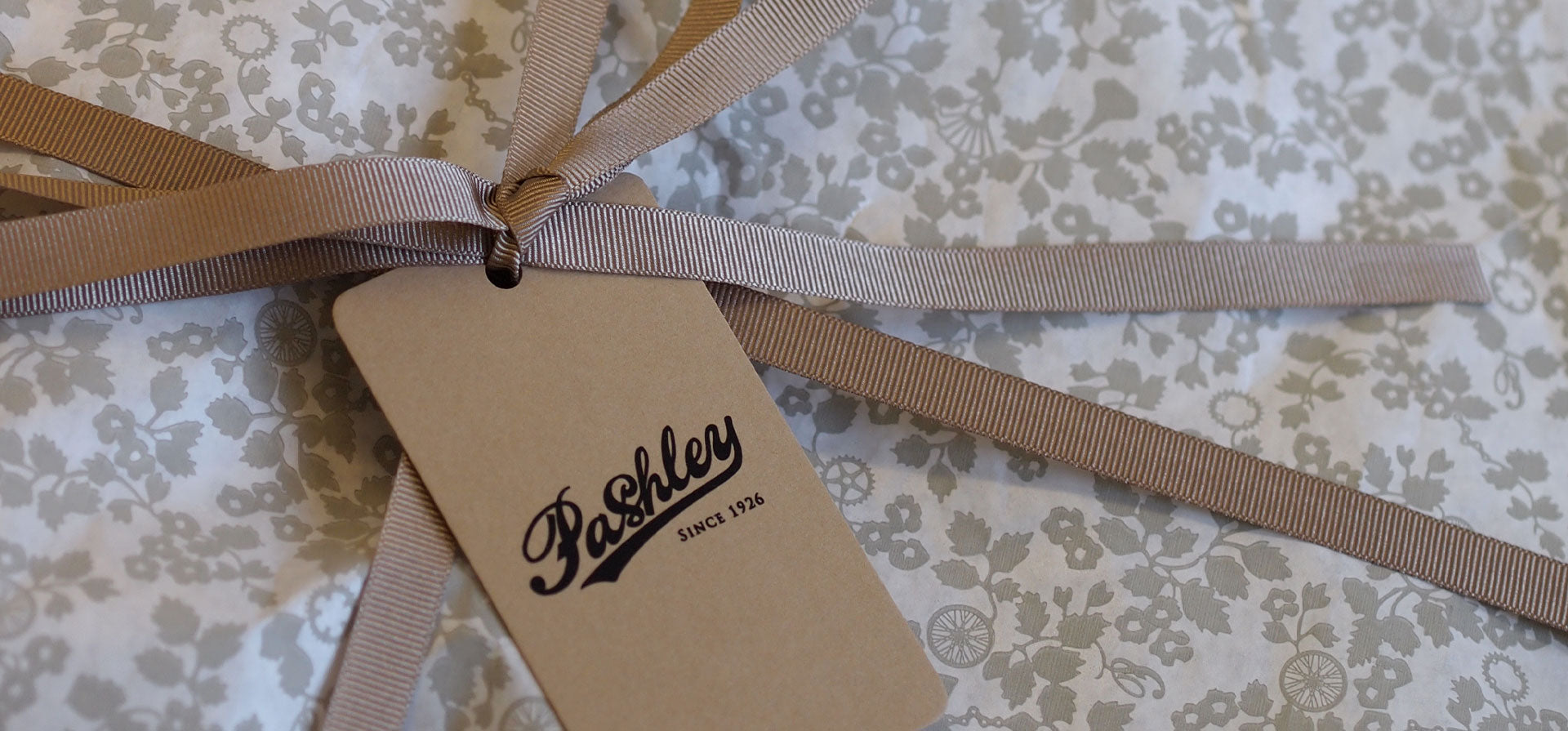 Gift wrapped in Pashley print wrapping paper with taupe ribbon and Pashley logo gift tag.