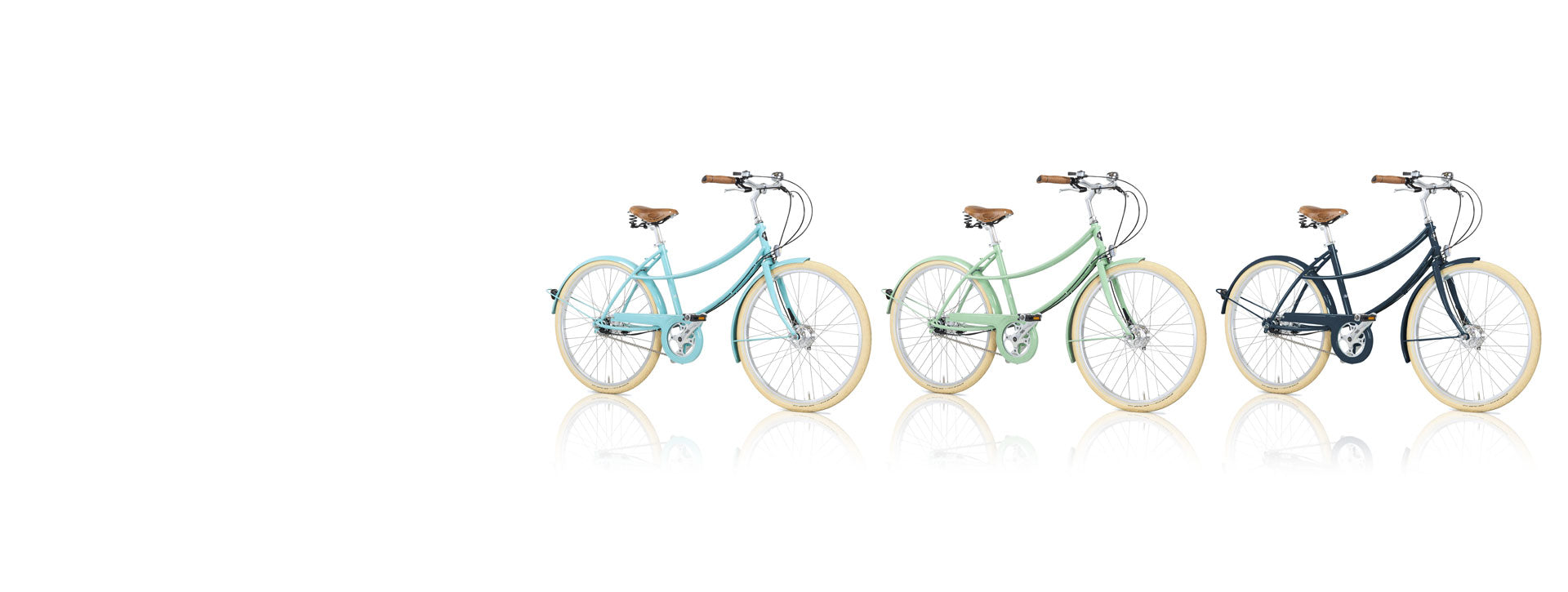 Three double loop frame bicycles, with leather saddles and cork grips. In light blue, mint and dark blue.