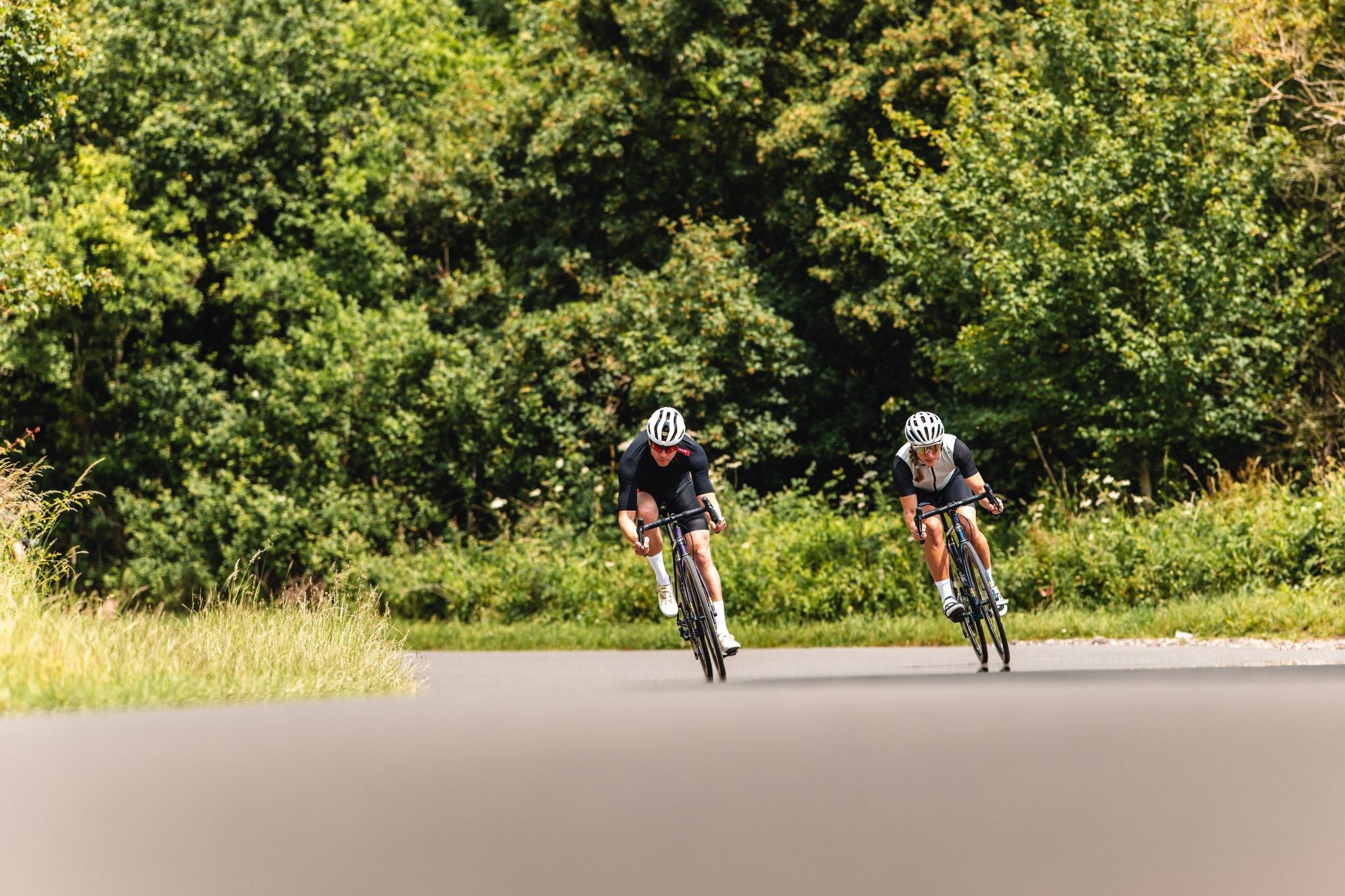 Two cyclists riding around a corner on Pashley Roadfinder SL bicycles