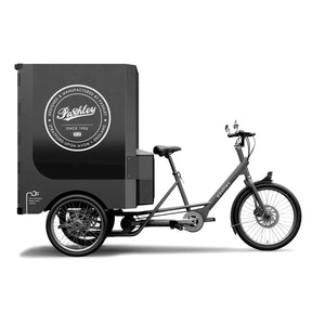 Side view of electric cargo trike with large branded cargo box on the rear.